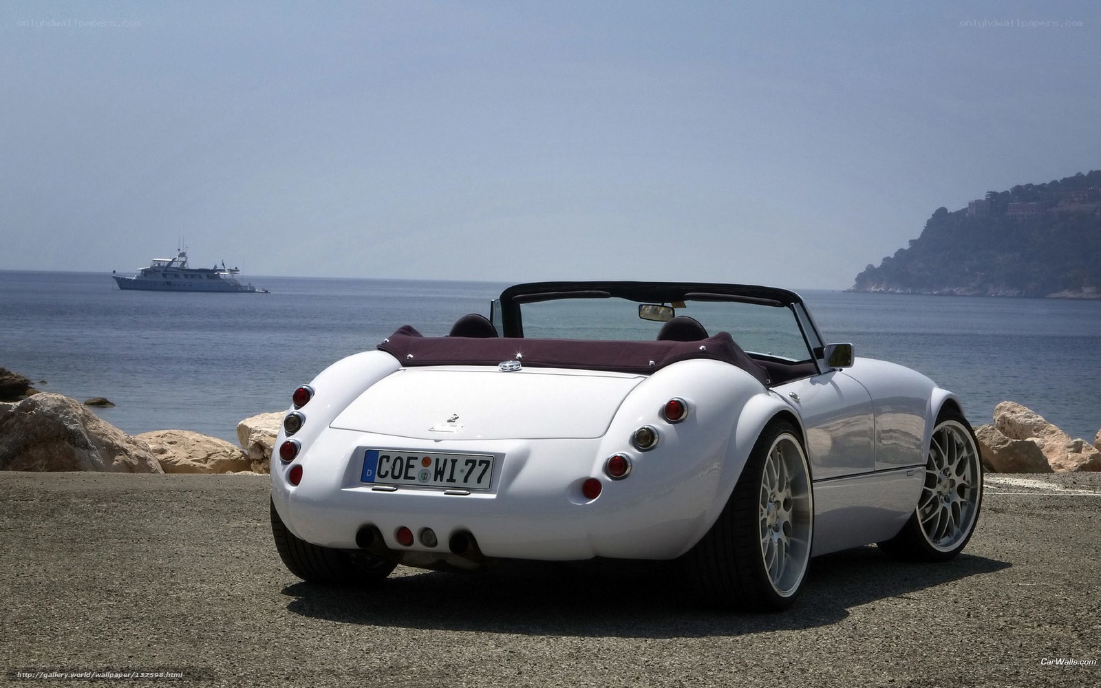 White convertible by the sea