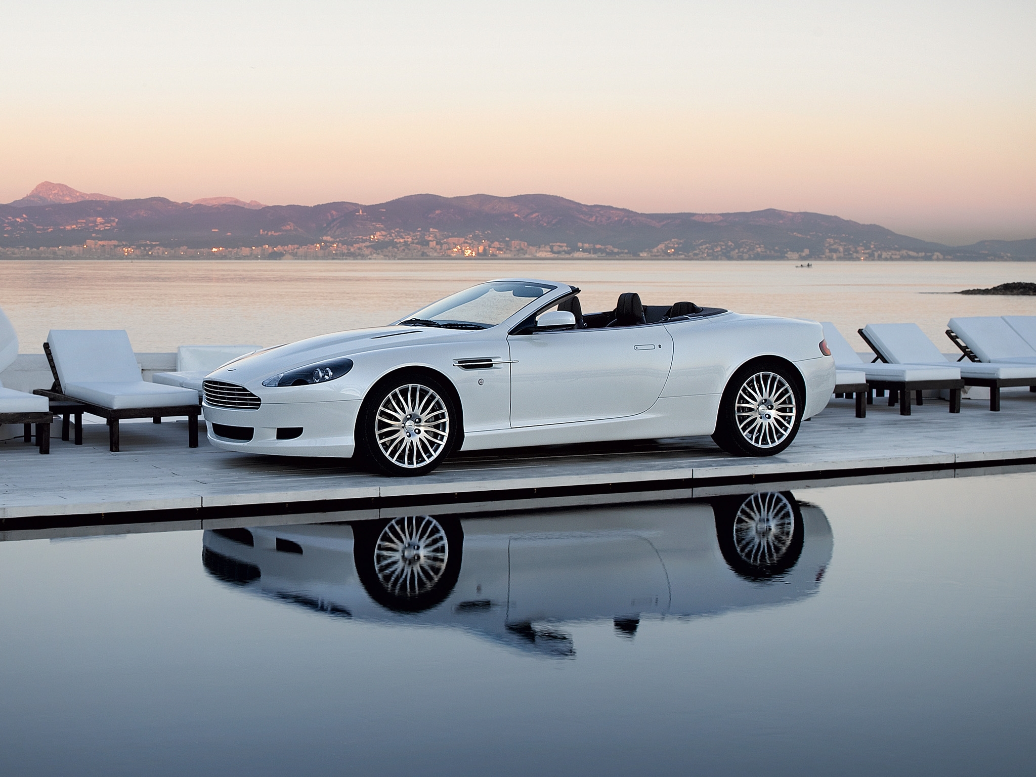 White convertible by the water