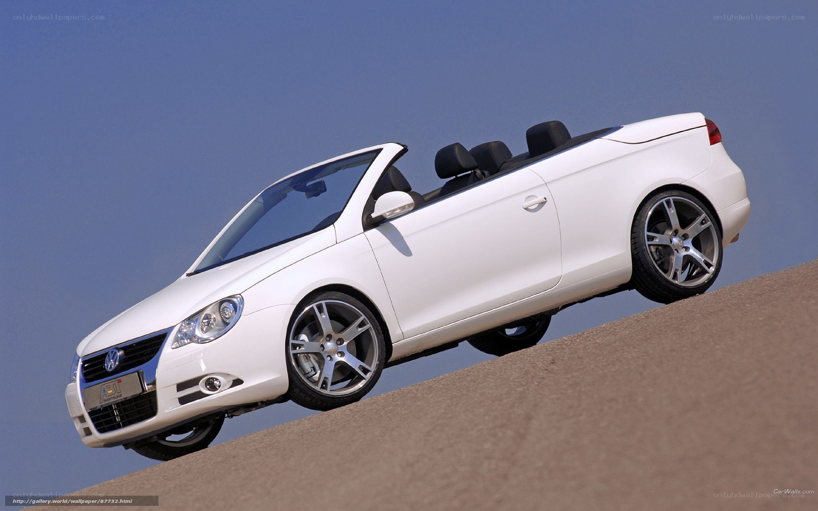 white convertible car on slope
