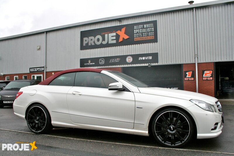 White convertible car outside workshop