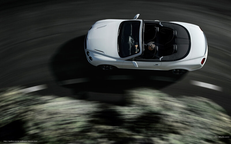 White convertible driving fast