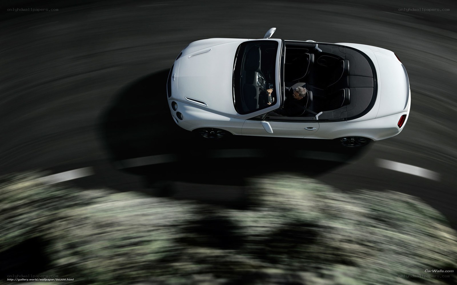 White convertible driving fast