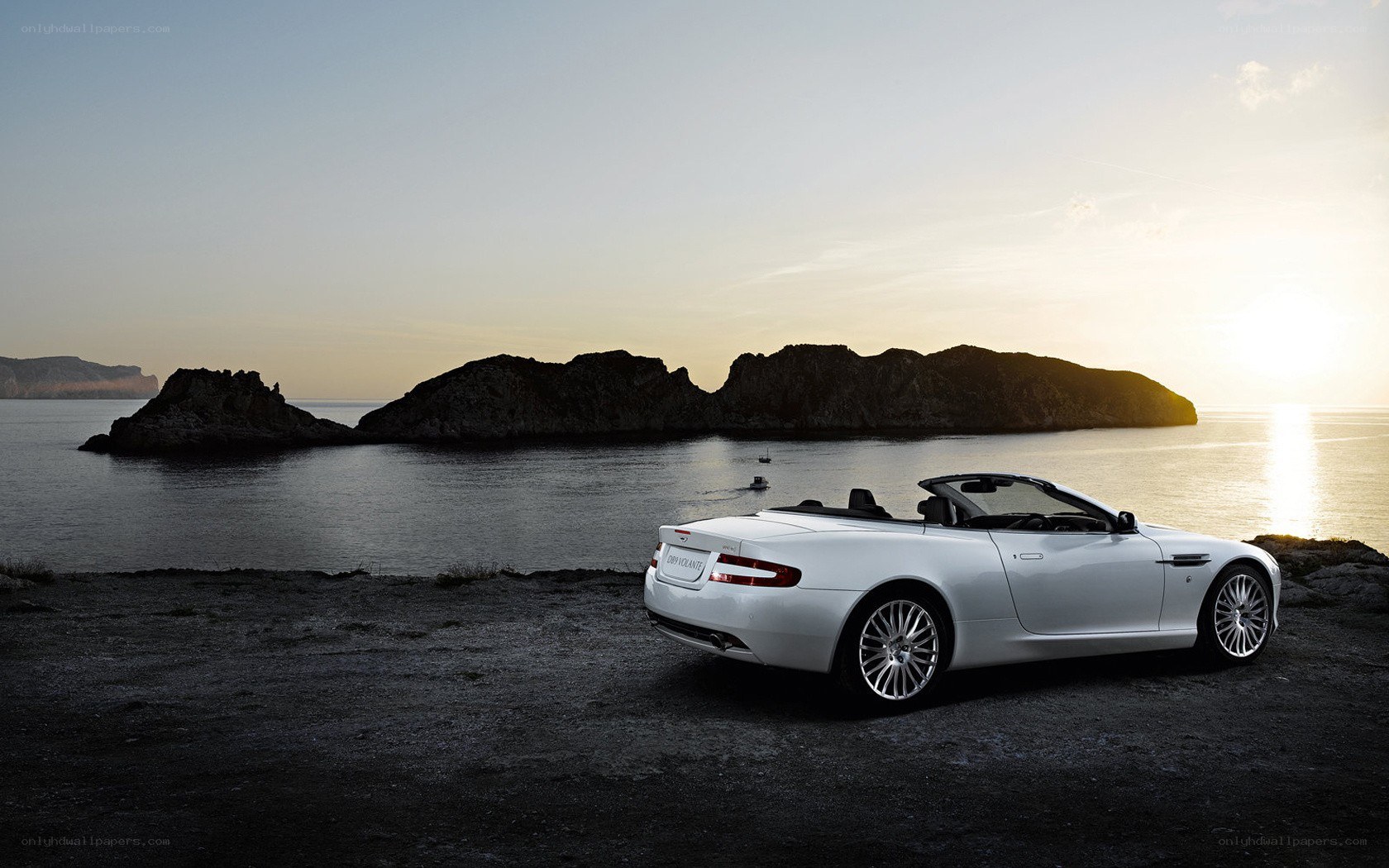 White convertible on a coastal cliff