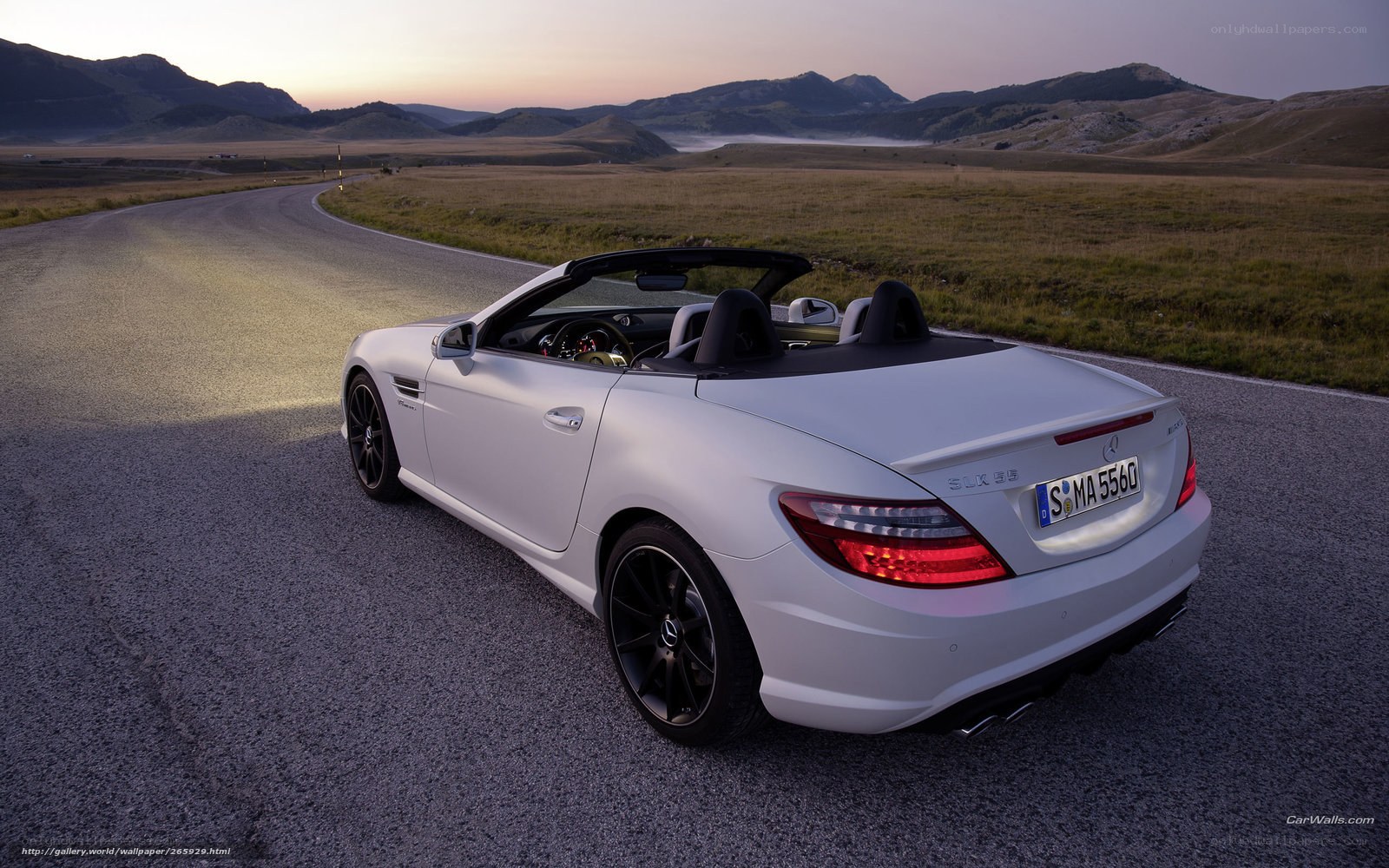 White convertible on a winding road