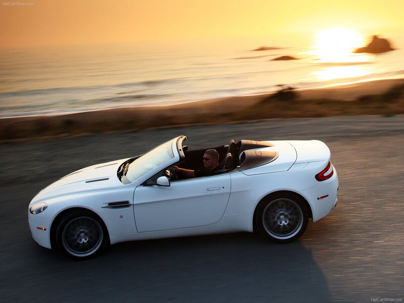 White convertible on coastal road