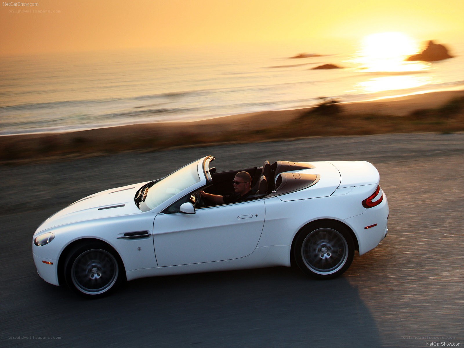 White convertible on coastal road