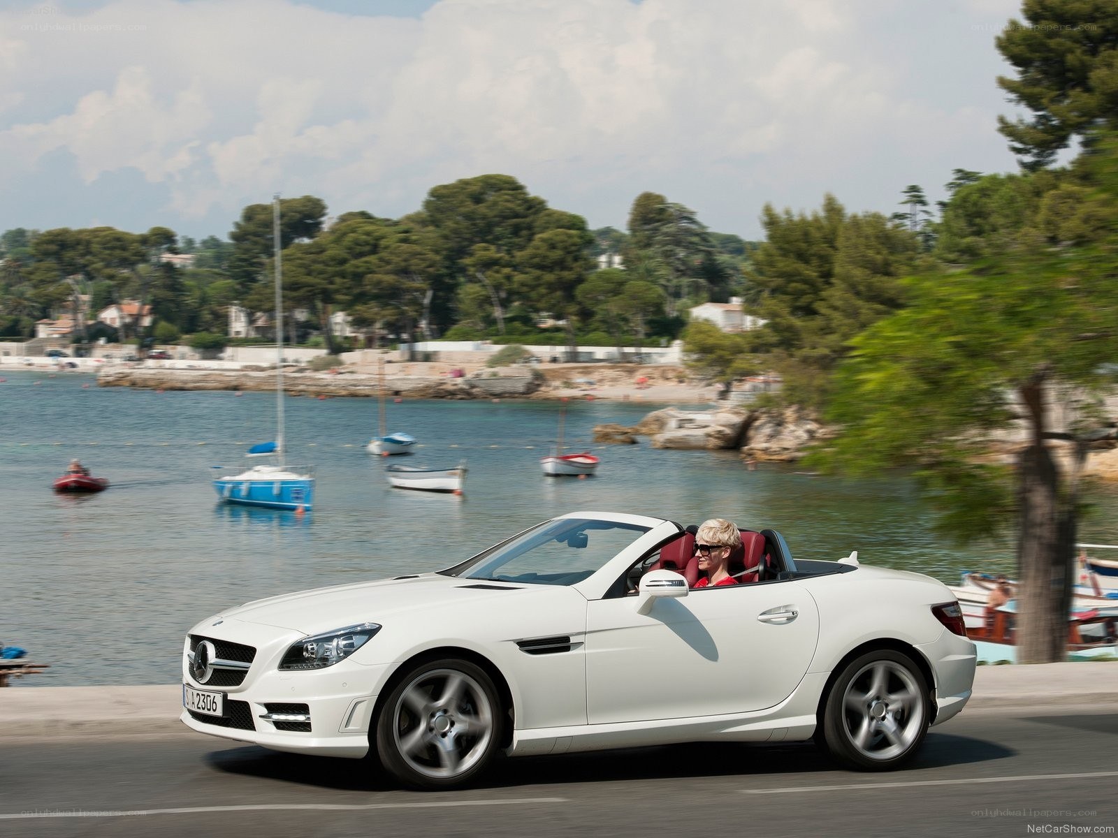 White convertible on coastal road