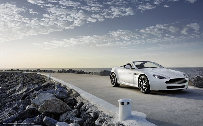 White convertible on coastal road