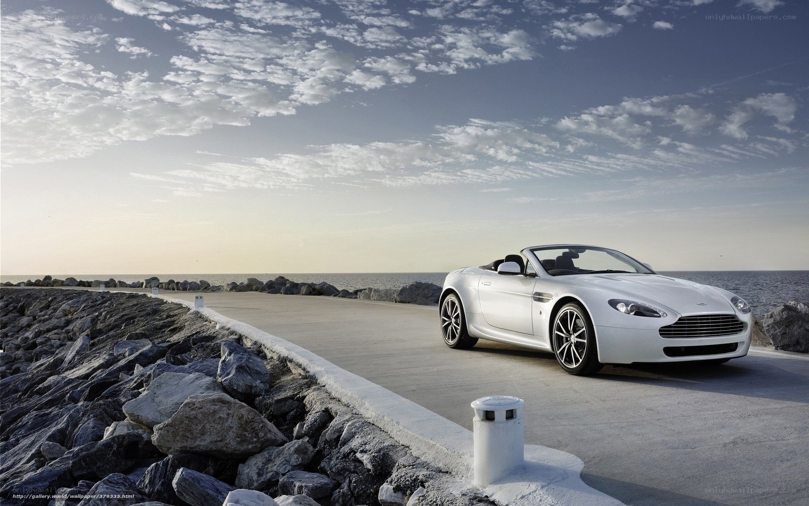 White convertible on coastal road