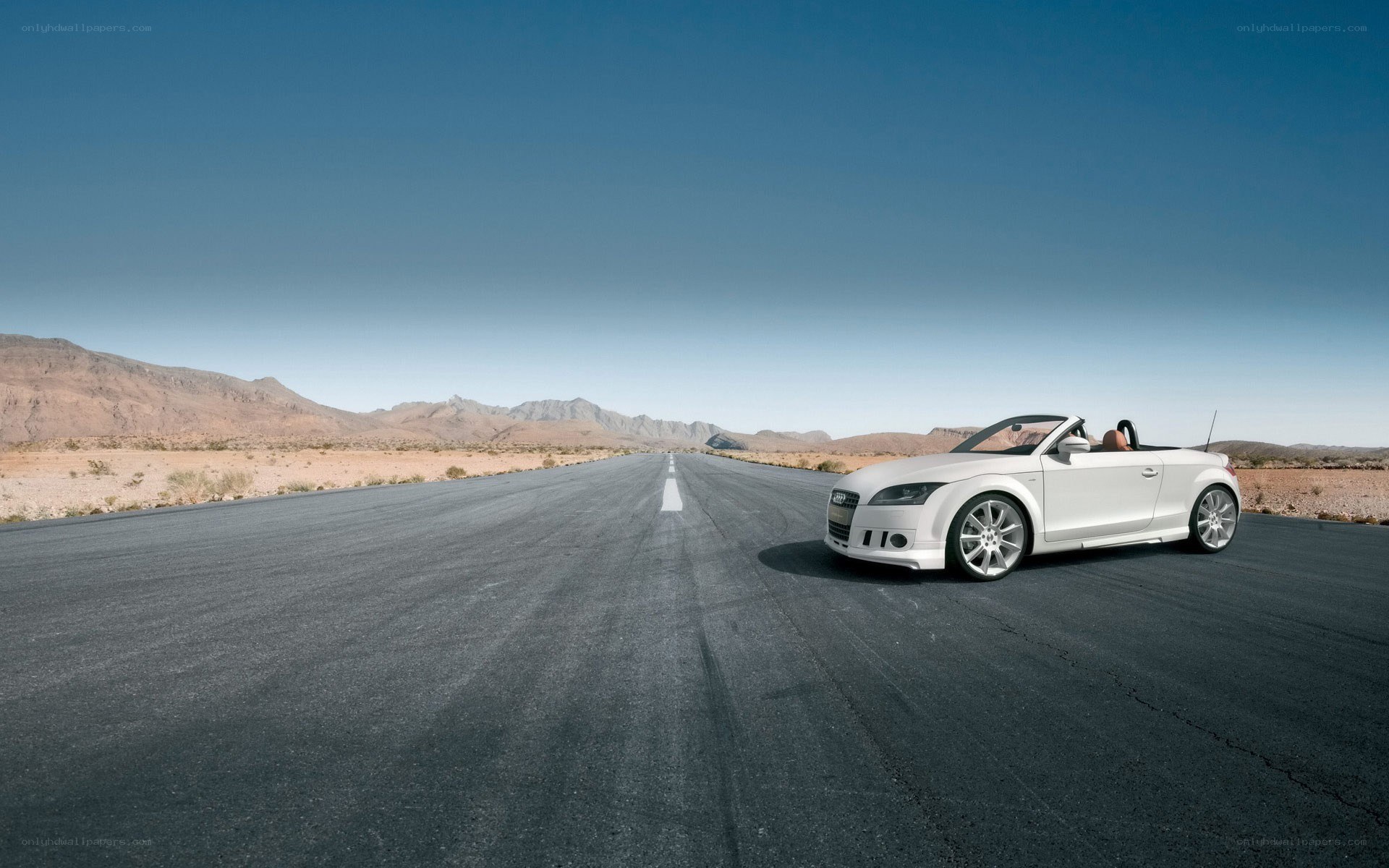White convertible on desert road