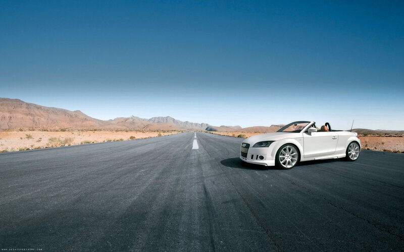 White convertible on desert road
