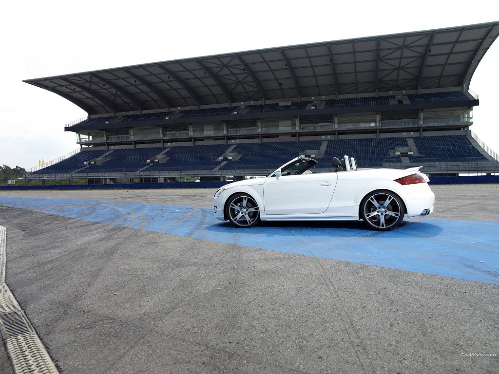 White convertible on racetrack