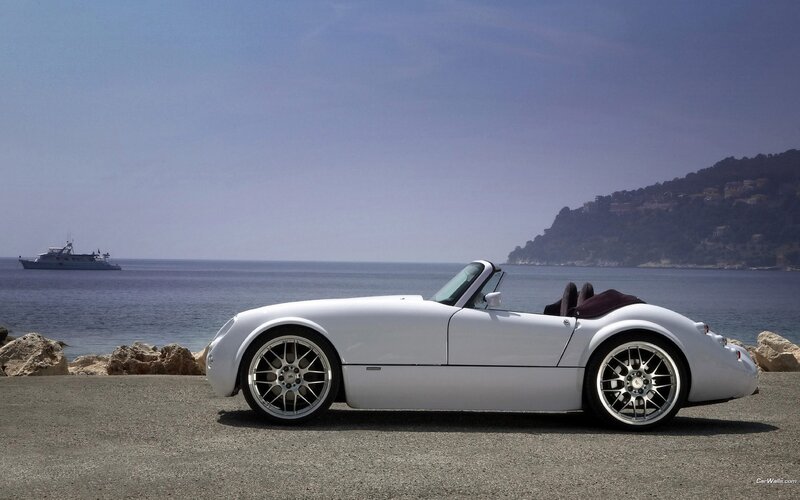 White convertible sports car by the sea