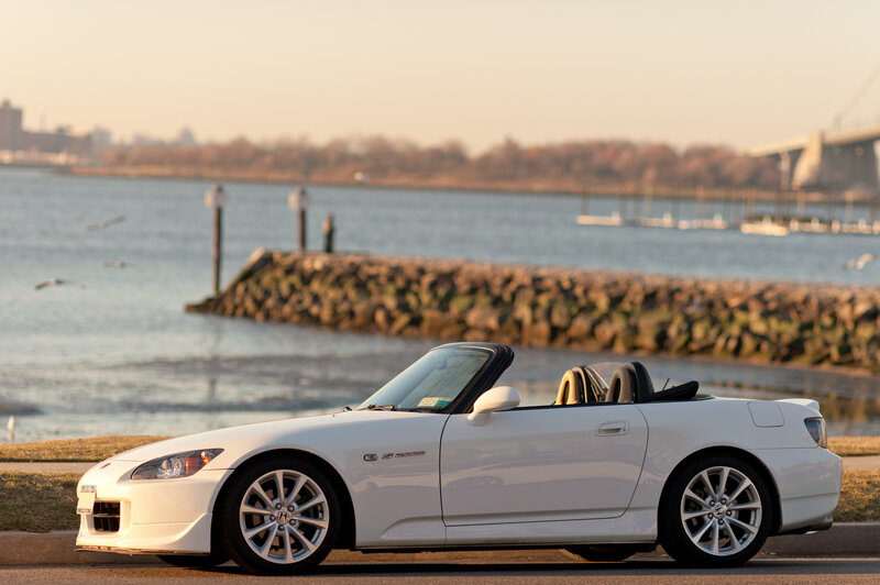 White convertible sports car by the water