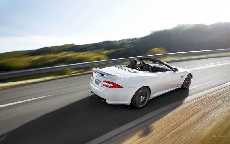 White convertible sports car driving