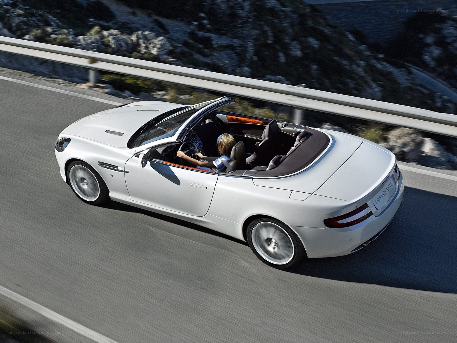 White convertible sports car driving