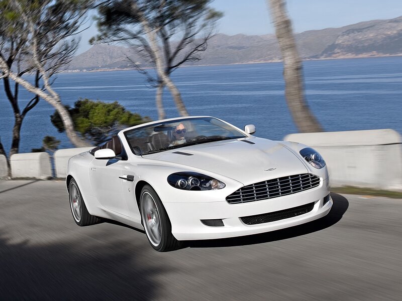 White convertible sports car on coastal road
