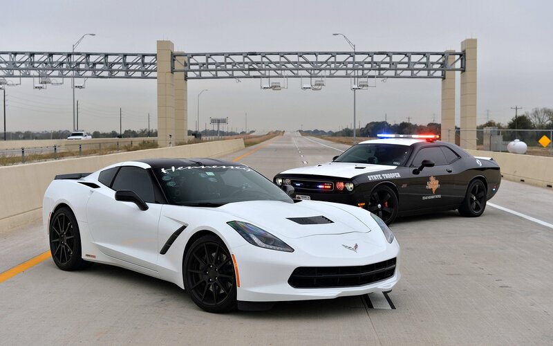 White Corvette and Police Car