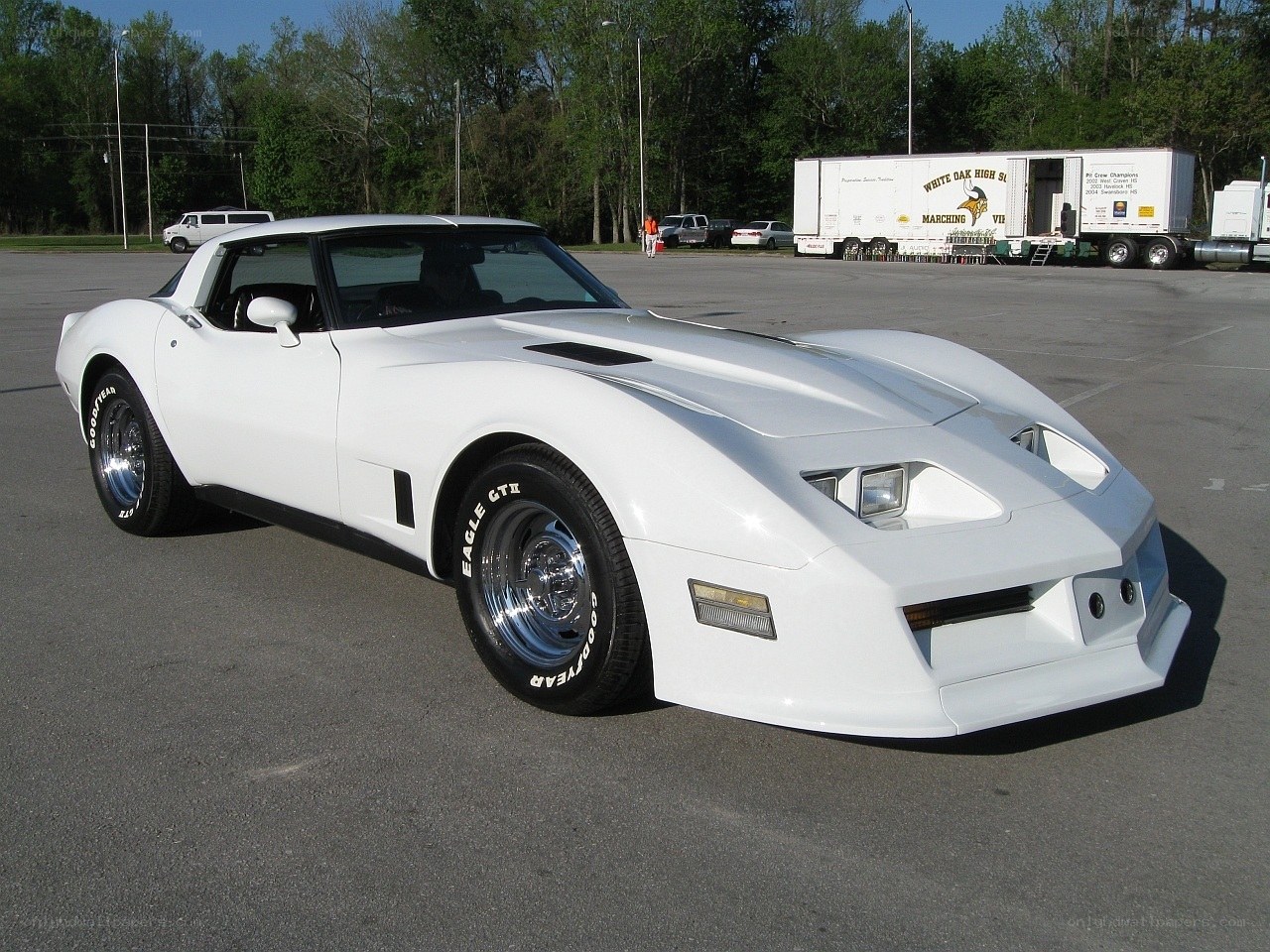 White Corvette C3 in parking lot