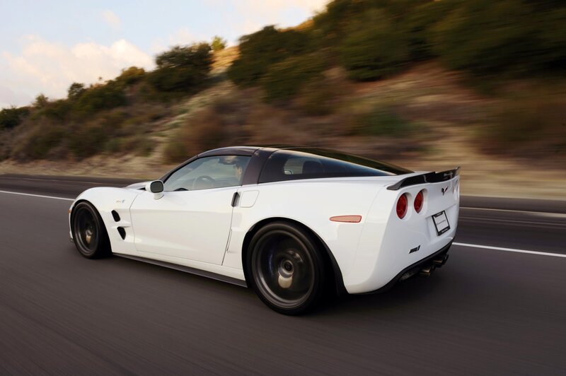 white corvette driving on road