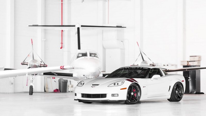 White Corvette in a hangar