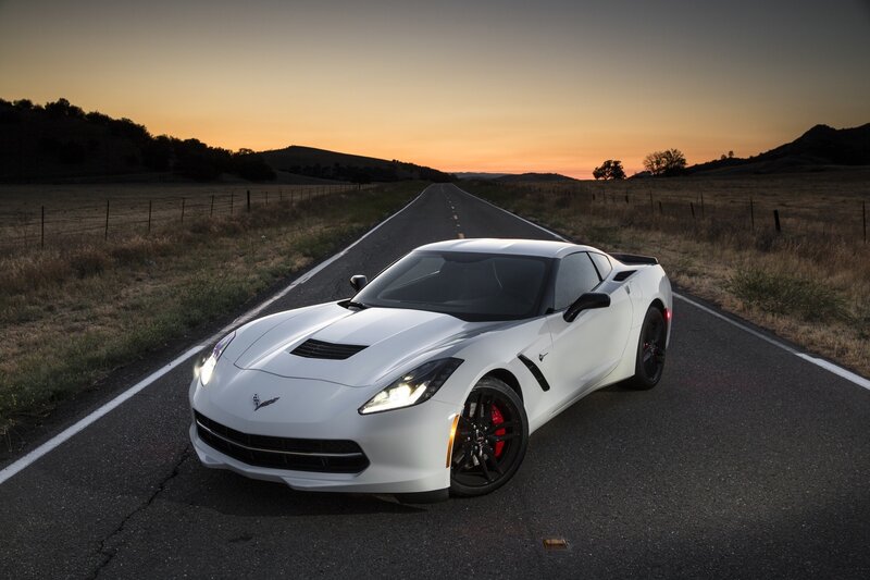 White Corvette on a country road