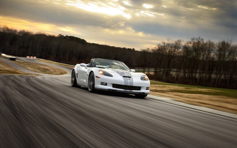 White Corvette on a racetrack