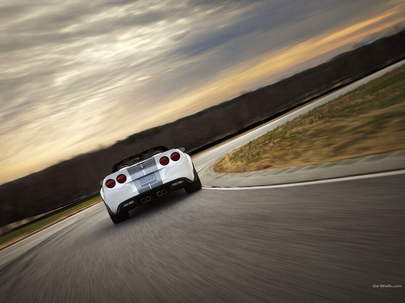 White Corvette on a racetrack
