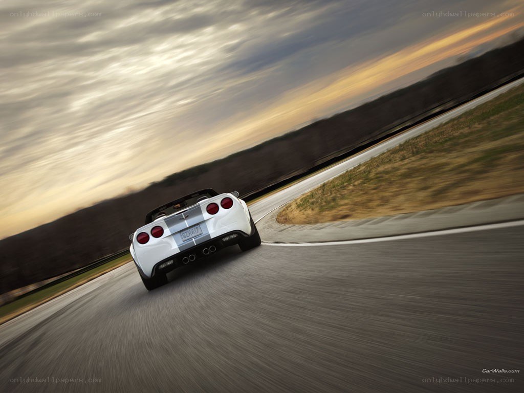White Corvette on a racetrack
