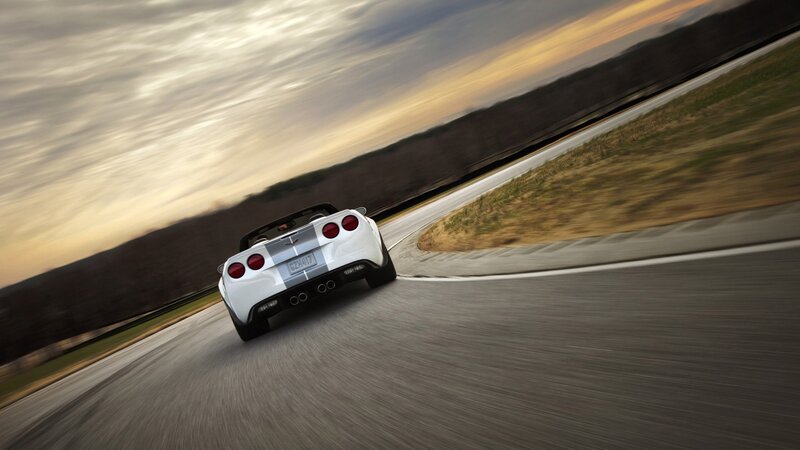 White Corvette on a winding road