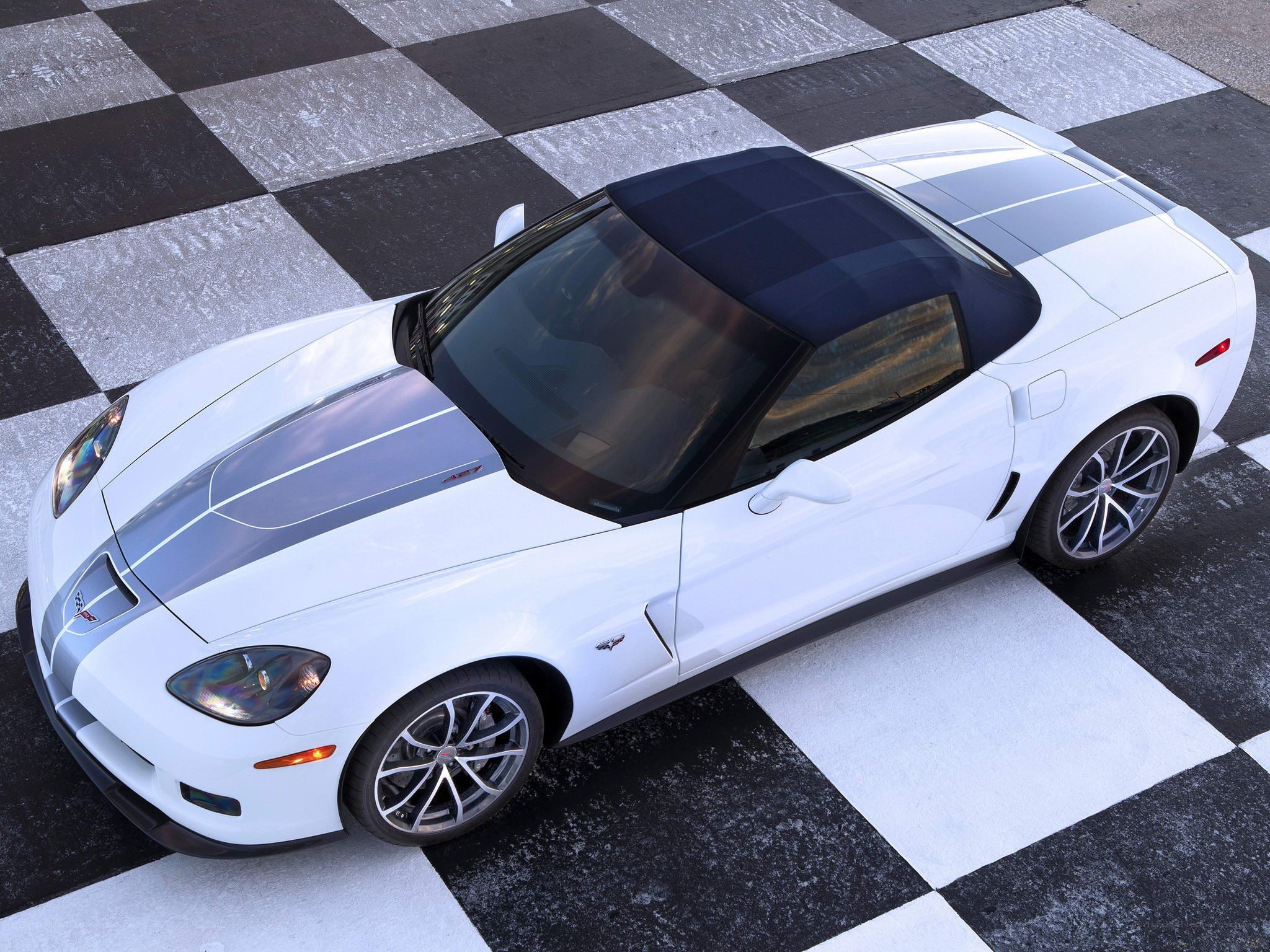 white corvette on checkered floor