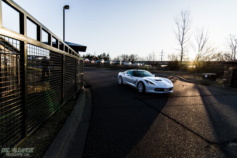 White Corvette on Road — Dramatic, Sunset