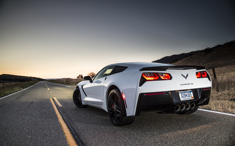 White Corvette on Road — Dramatic