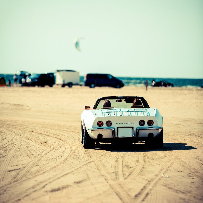 White Corvette on the beach