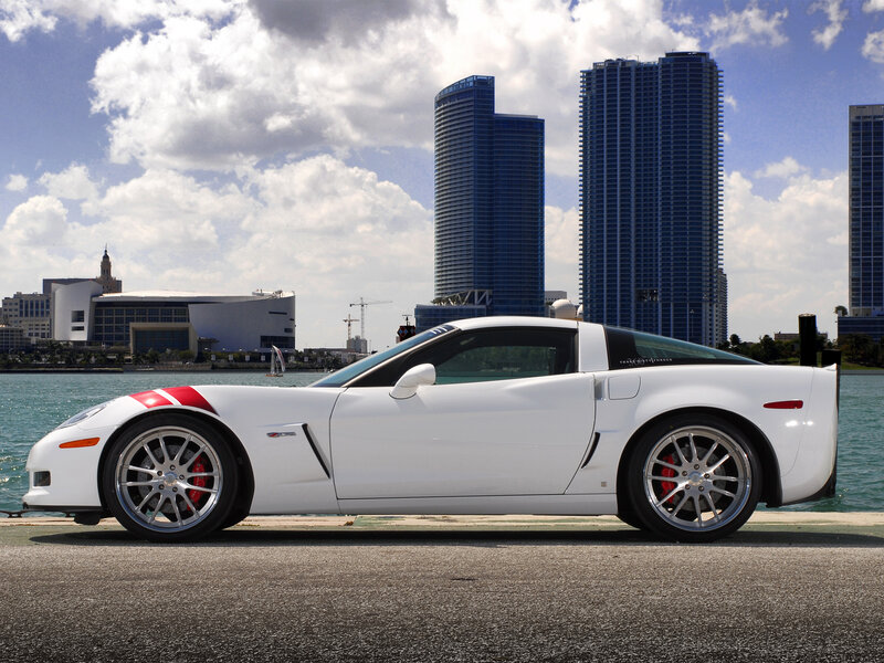 White Corvette on waterfront