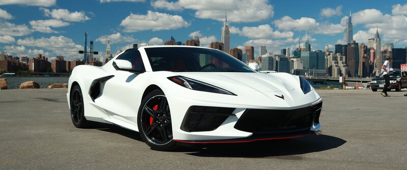 White Corvette Sports Car — Dramatic, Afternoon, Photograph, City Skyline
