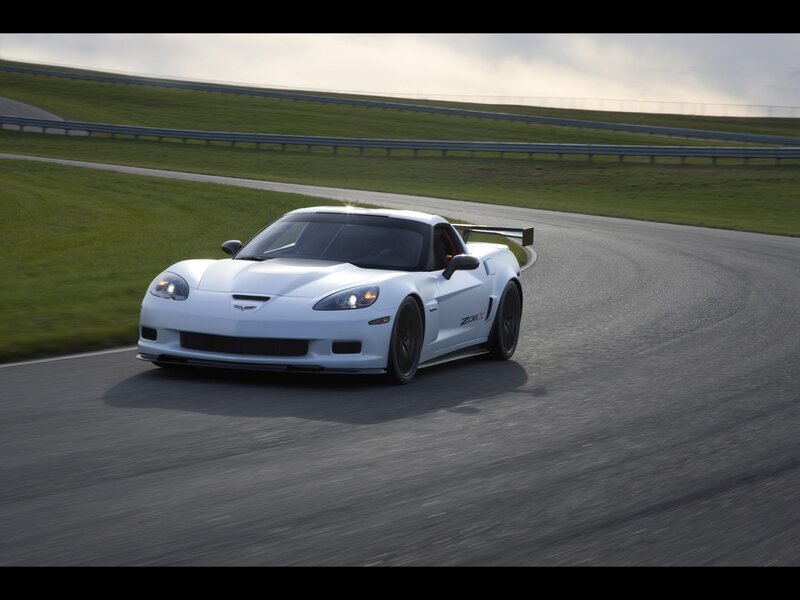 White Corvette Z06 on a racetrack
