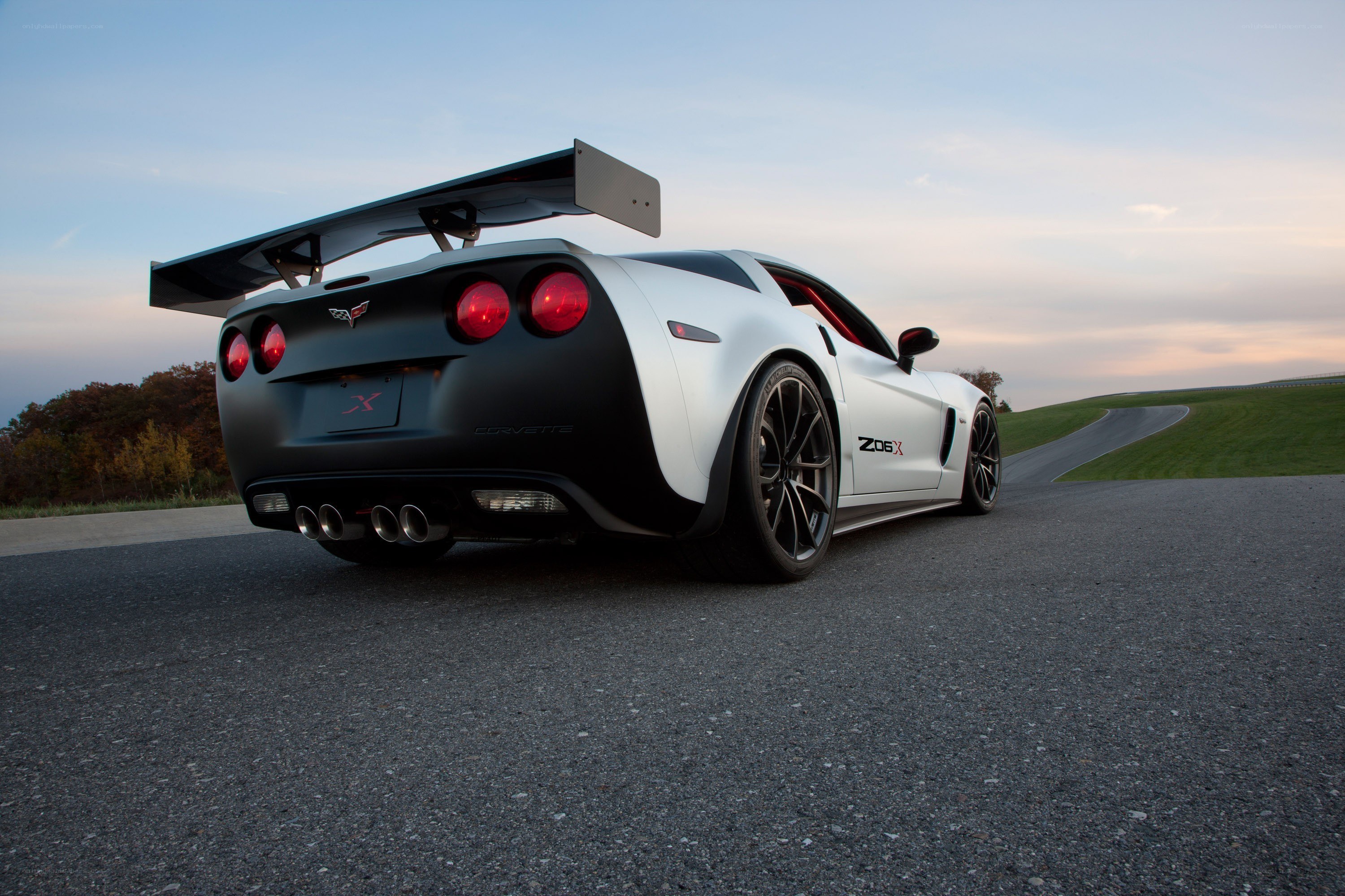 White Corvette Z06 on a racetrack