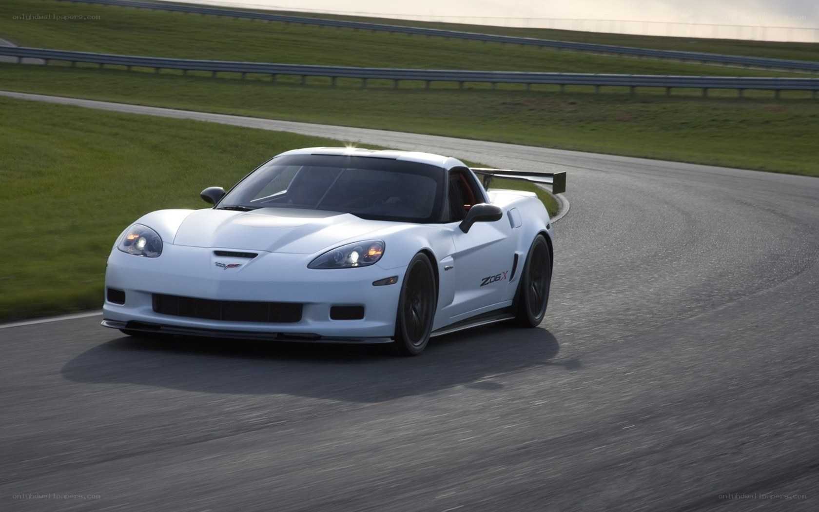 White Corvette Z06 on racetrack