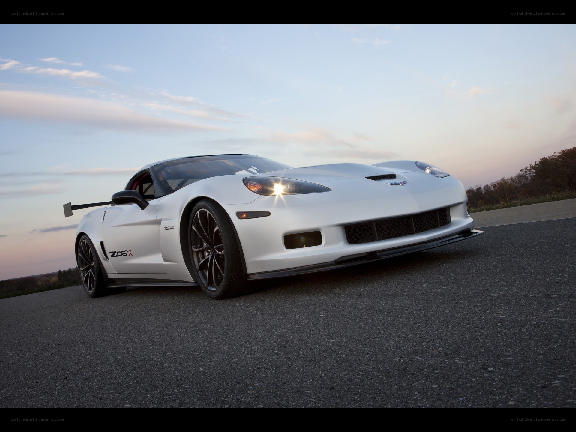 White Corvette Z06 X on a track