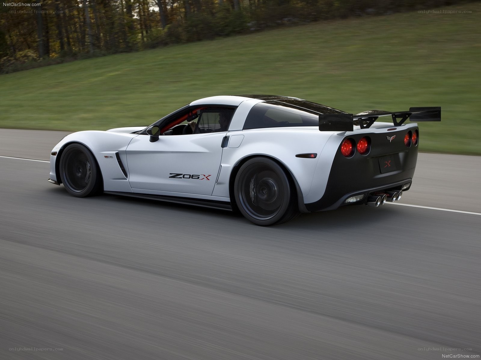 White Corvette Z06X on a track