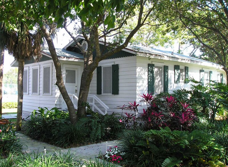 White Cottage with Green Shutters