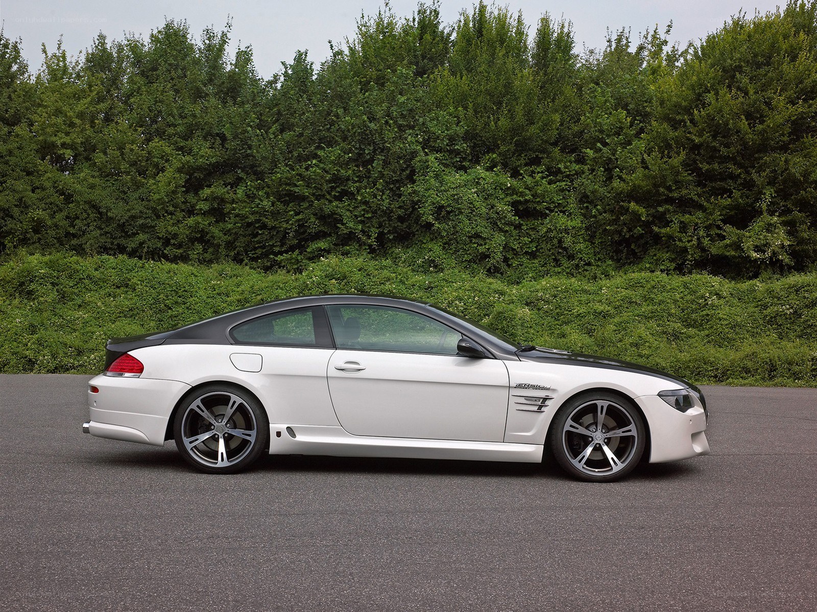 white coupe car on asphalt