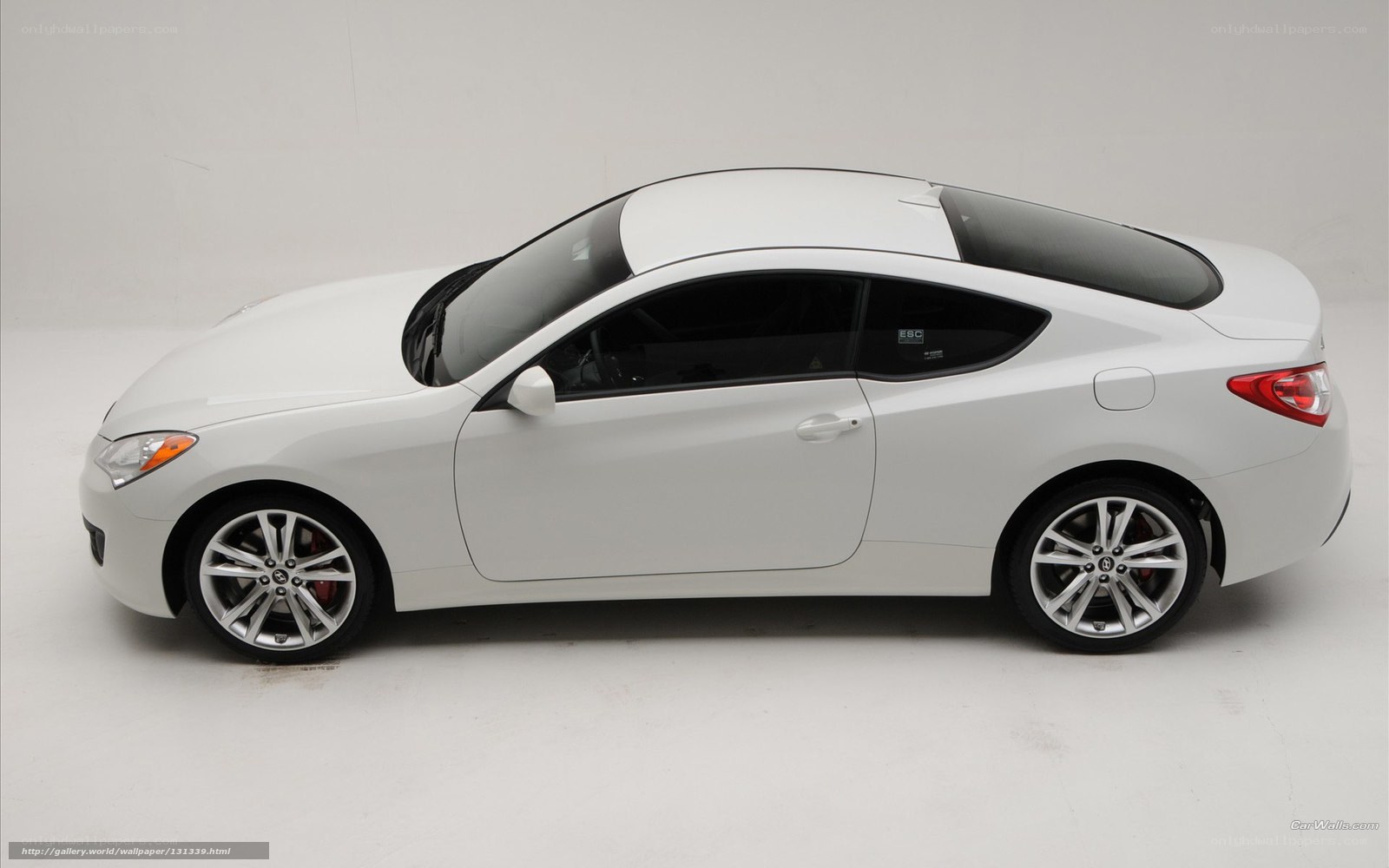 white coupe car side view
