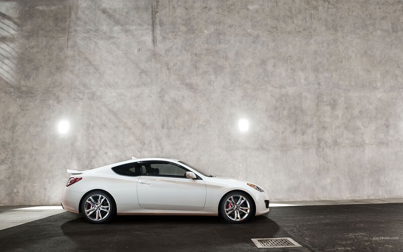 white coupe in concrete garage