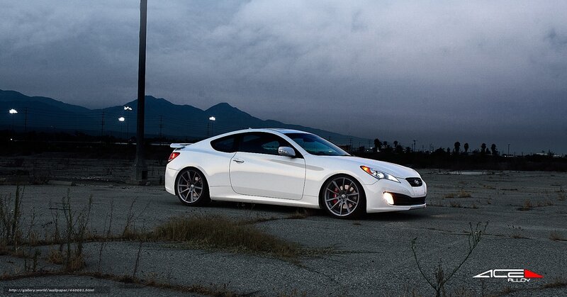 white coupe in empty lot