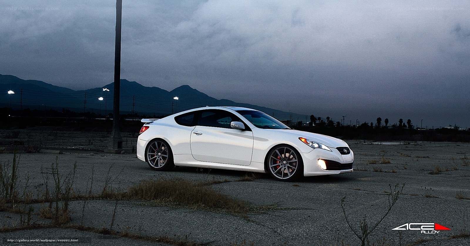 white coupe in empty lot