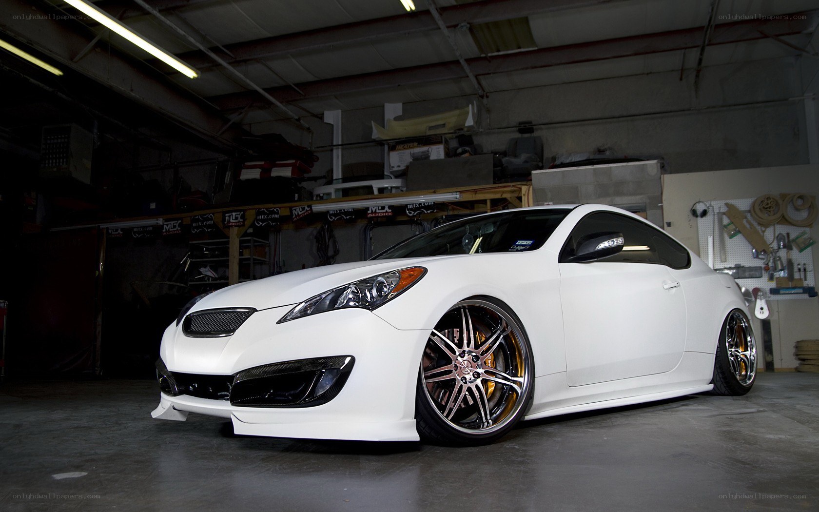 white coupe in garage