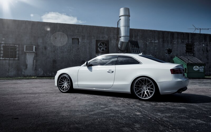 white coupe in industrial setting