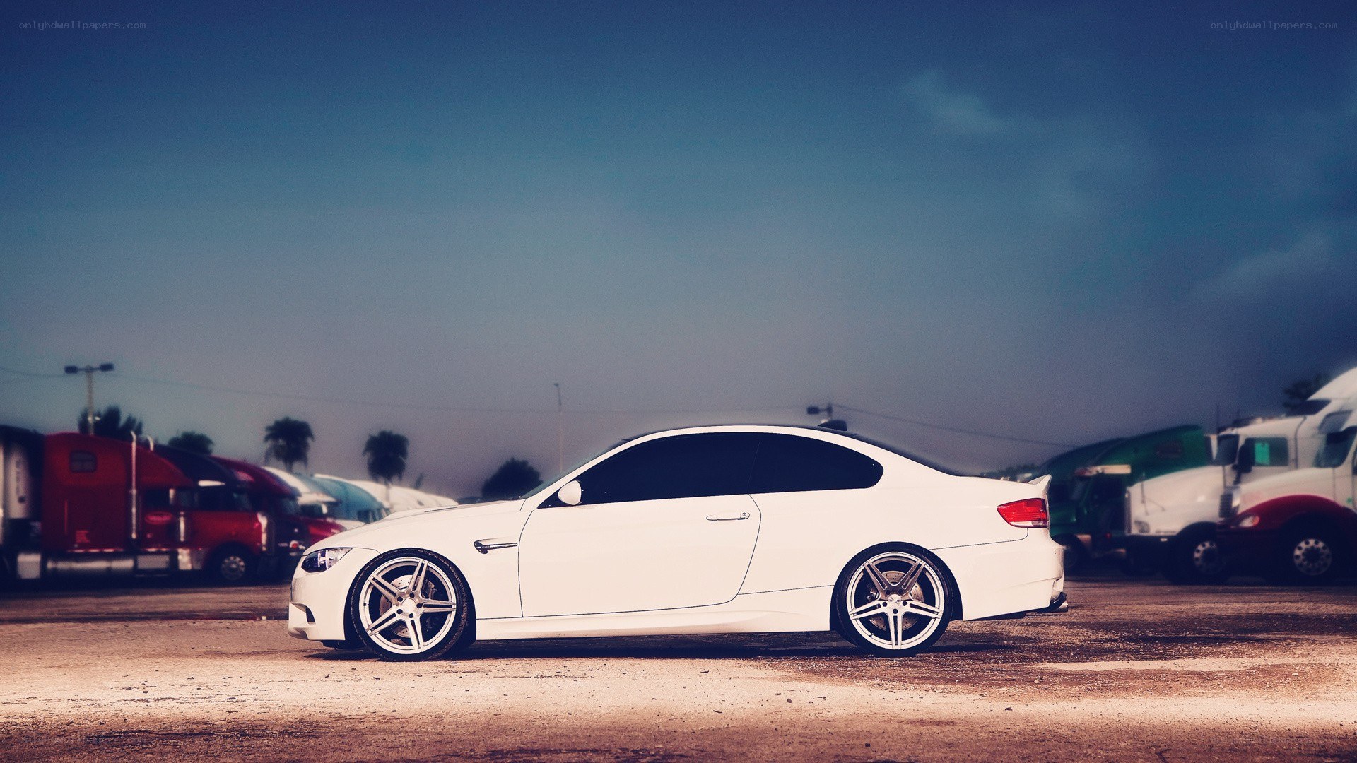 white coupe in parking lot